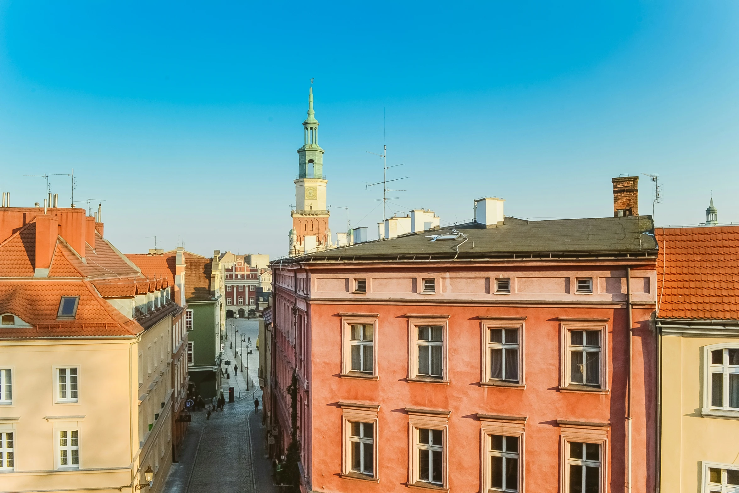 a view of a tall tower and some buildings