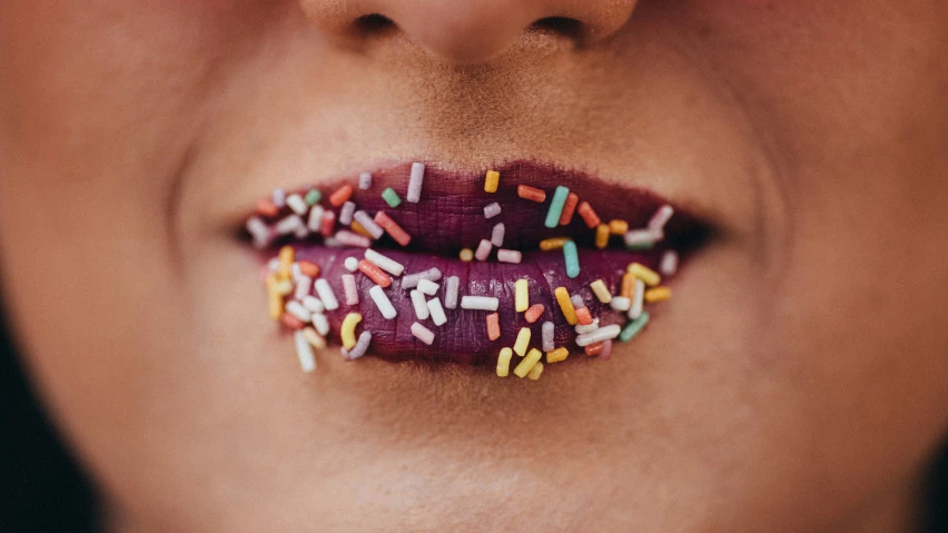 a woman's lipstick has sprinkles on it