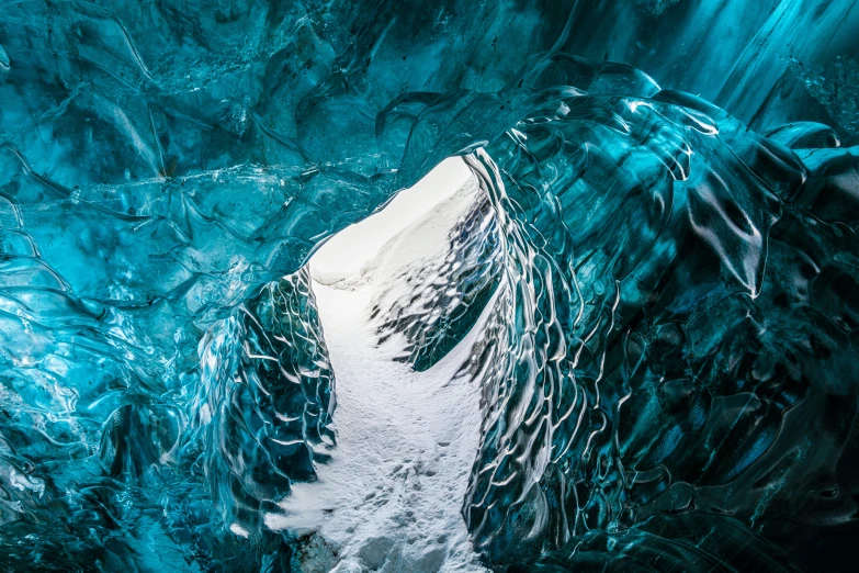 inside a very icy ice cave that looks like it is melting