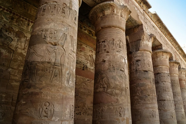 some ancient pillars with different carvings on them