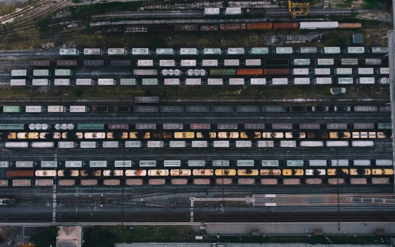 a group of old train tracks with train cars