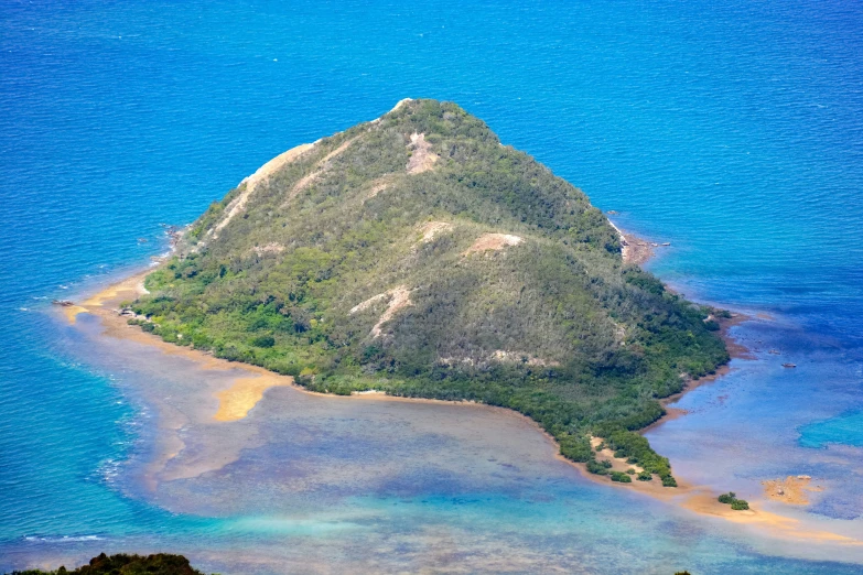 an island is in the middle of a body of water