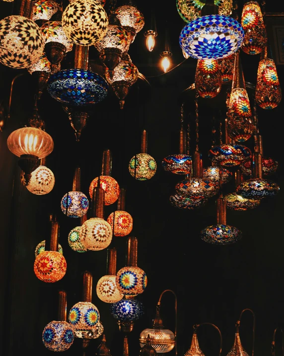 many lamps in different sizes and colors on display