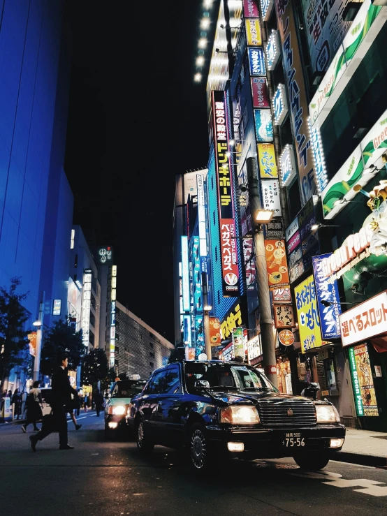 there are many bright signs on the buildings