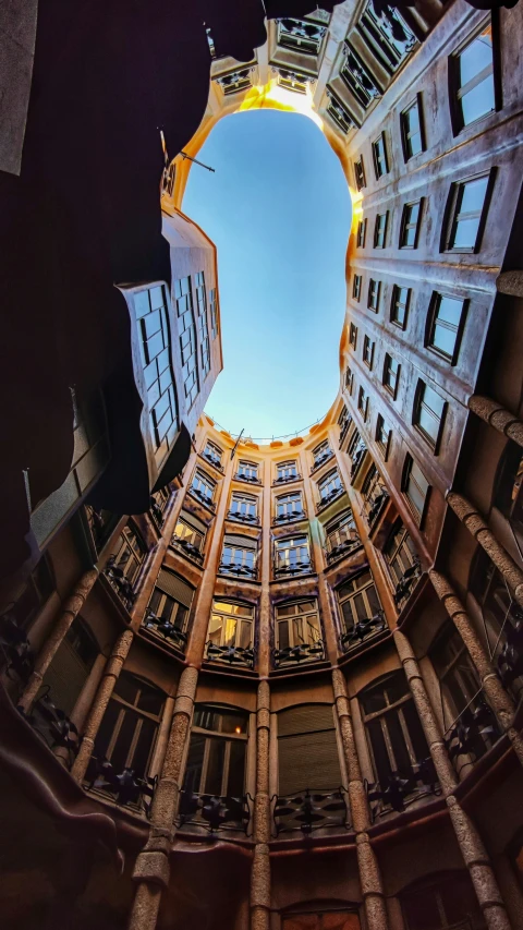 an old looking building has a sky view through it