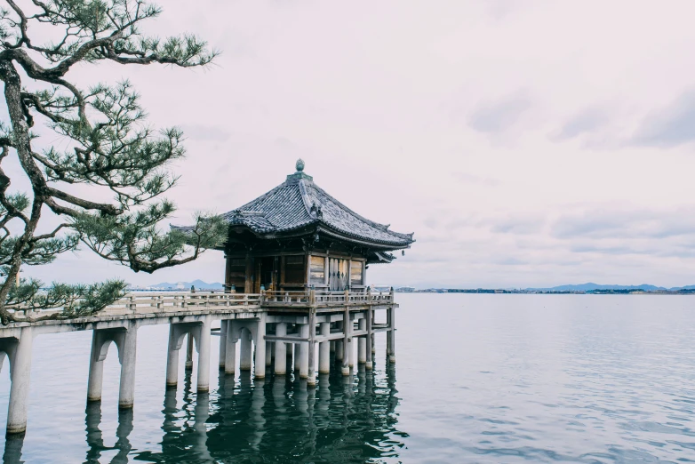 an empty pier in the middle of water