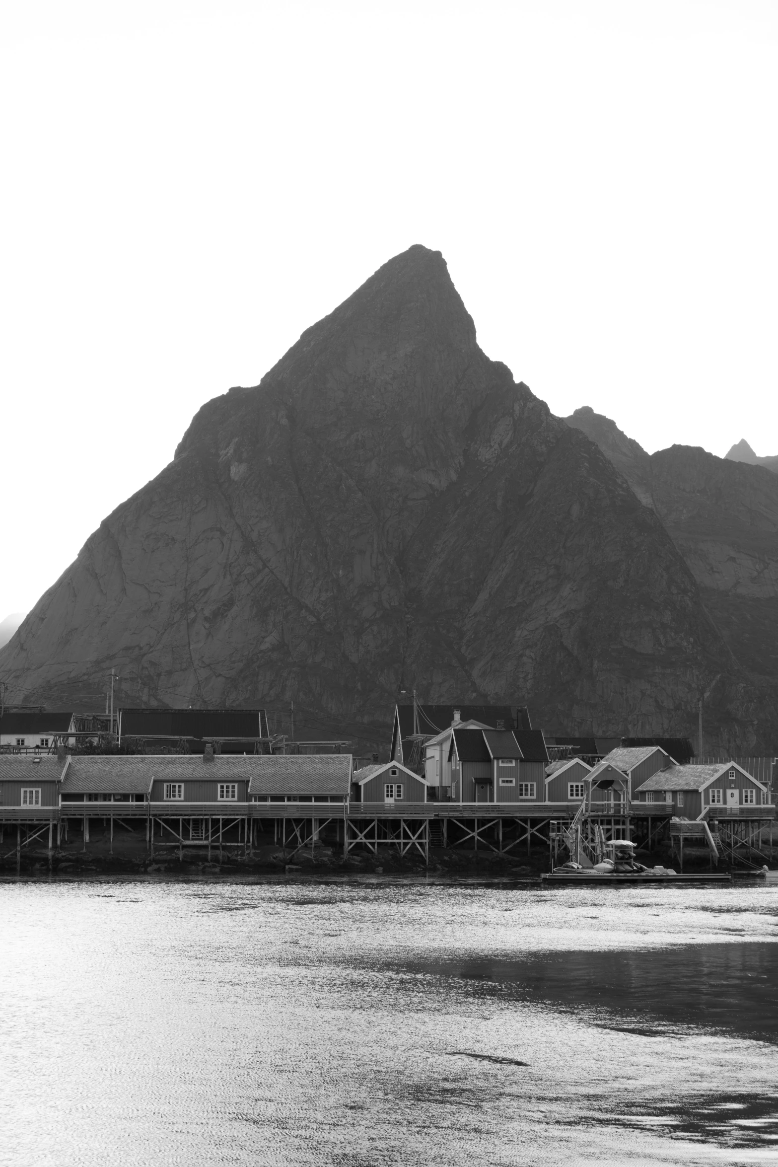 a black and white po of a large mountain range in the distance