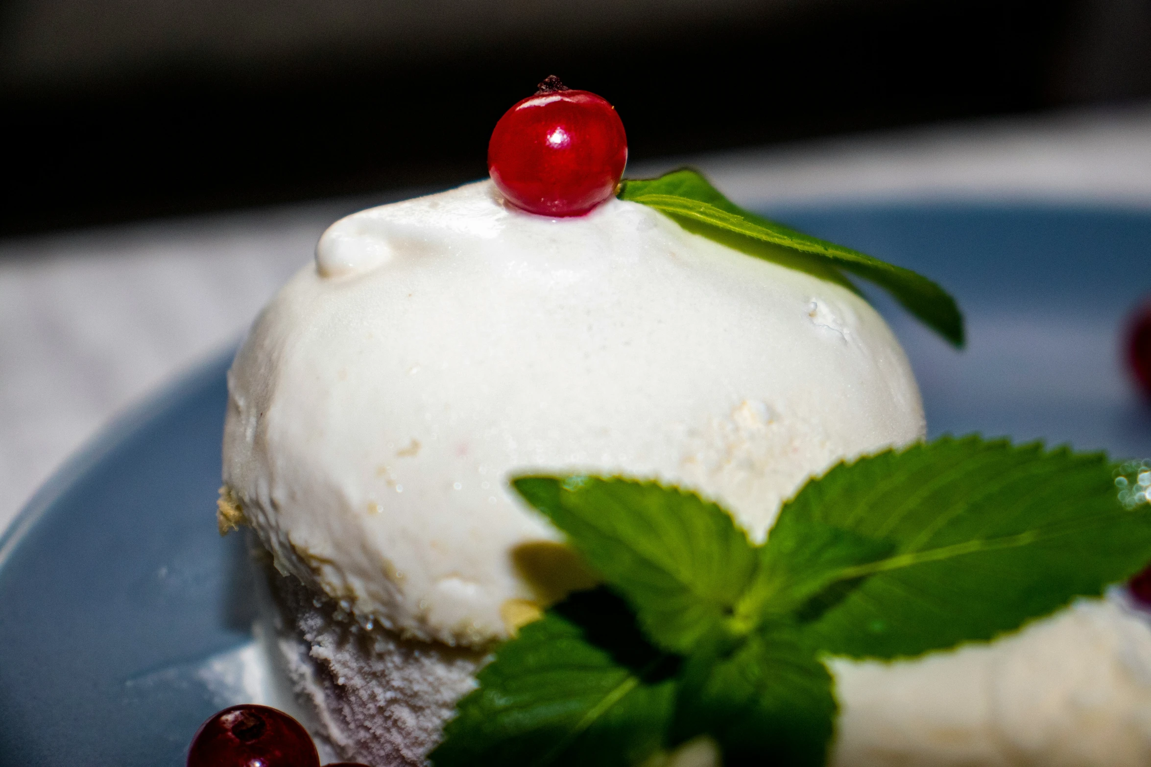 a plate topped with a very fancy cake and cherries