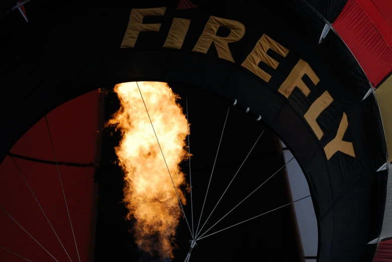 a fire is coming out of the hole of an air balloon