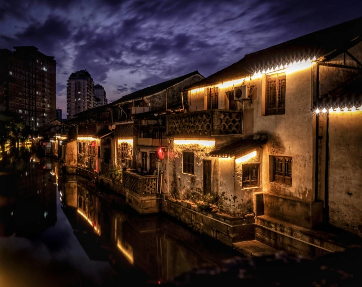 several buildings next to each other lit up with lights