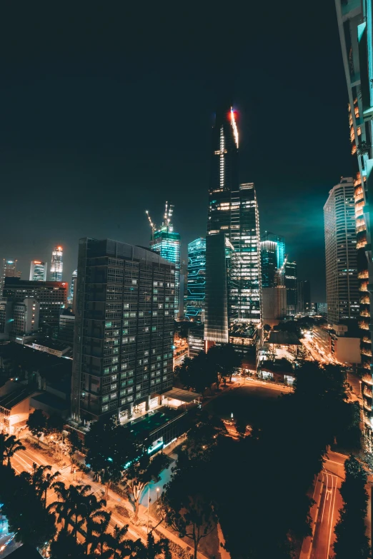 a city skyline in the dark with lit up buildings