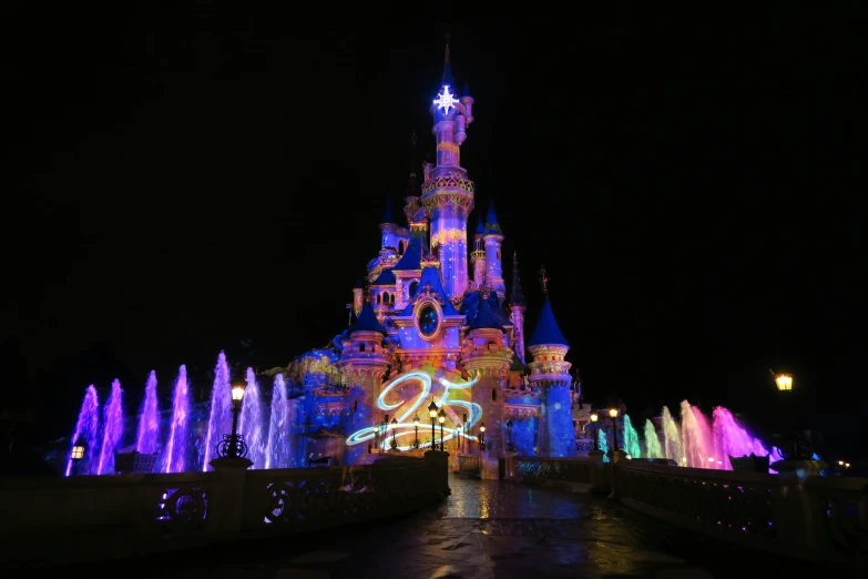 lights and water shooting off the castle during the holidays