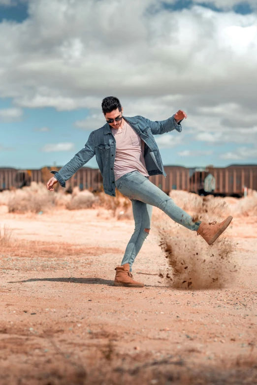 a person riding a skateboard on a dirt field