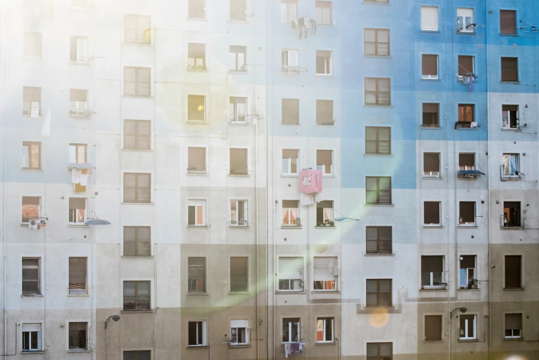 windows in the sky over a block wall