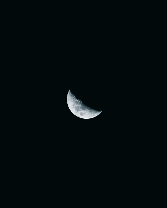 the half moon is visible with a dark background