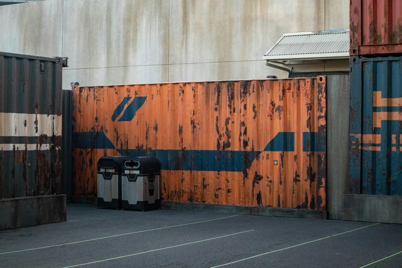 the door to an outside area with some orange and blue walls