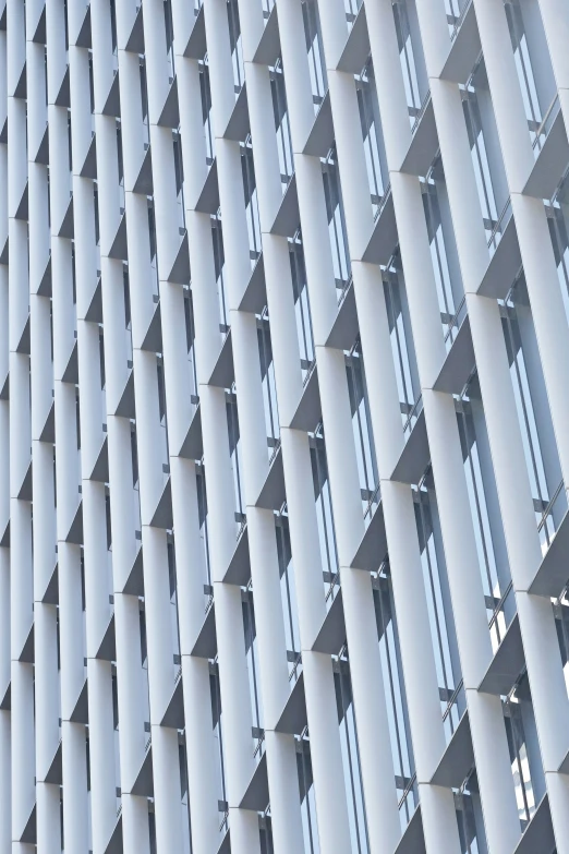 a modern building is shown with a white metal lattice structure
