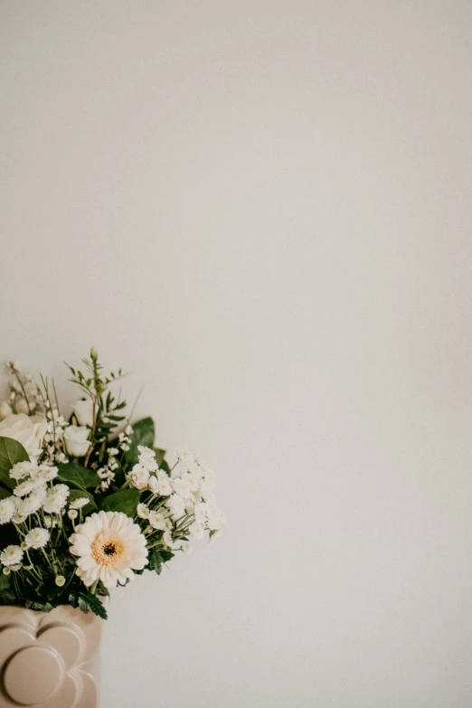 an arrangement of flowers are set up in a vase