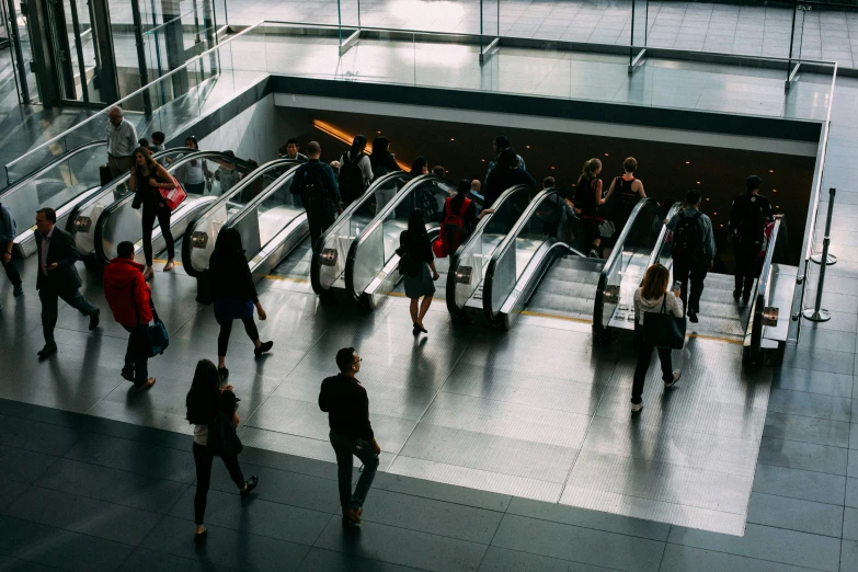 a very large crowd of people standing in front of a train