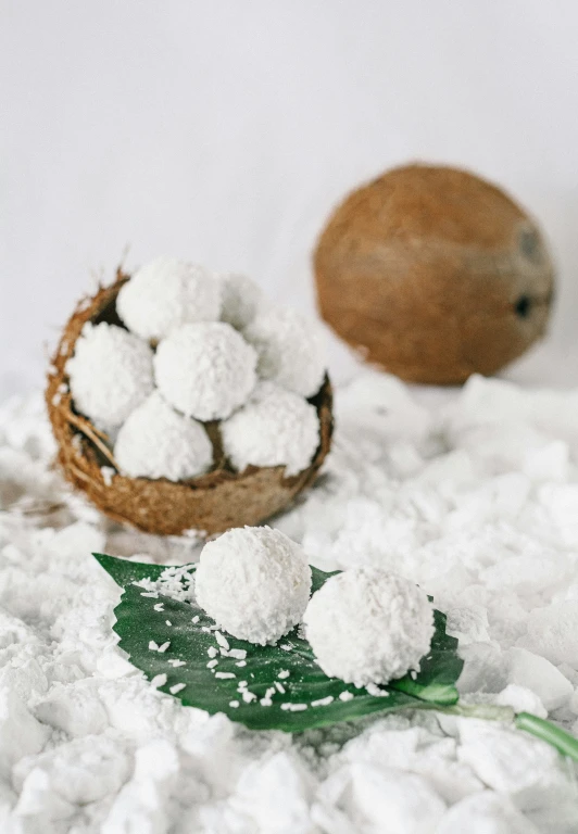 a basket of cotton with some white powder on it