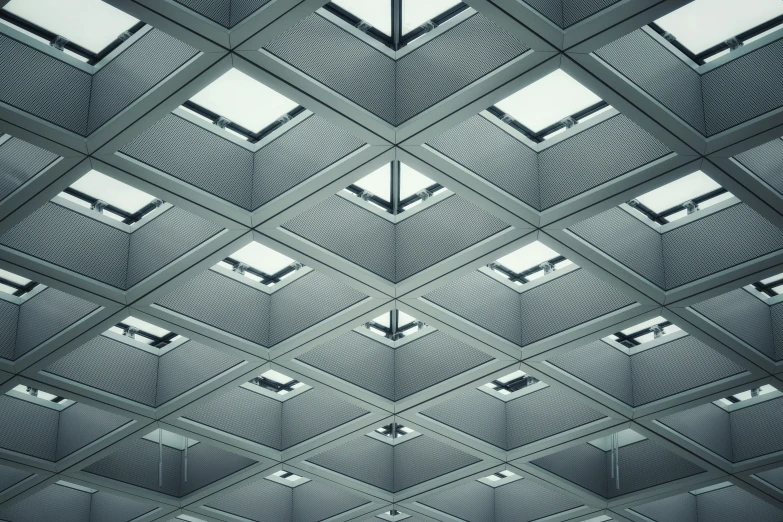 a ceiling in a building has many small squares on it