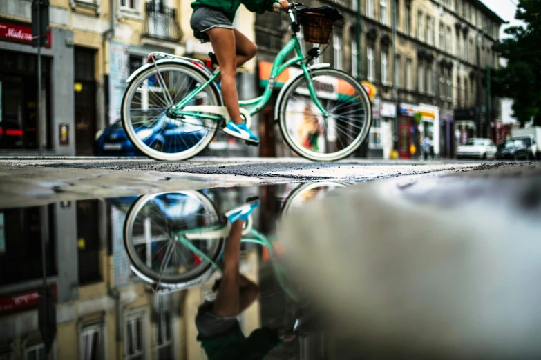 a person riding on a bike down the street