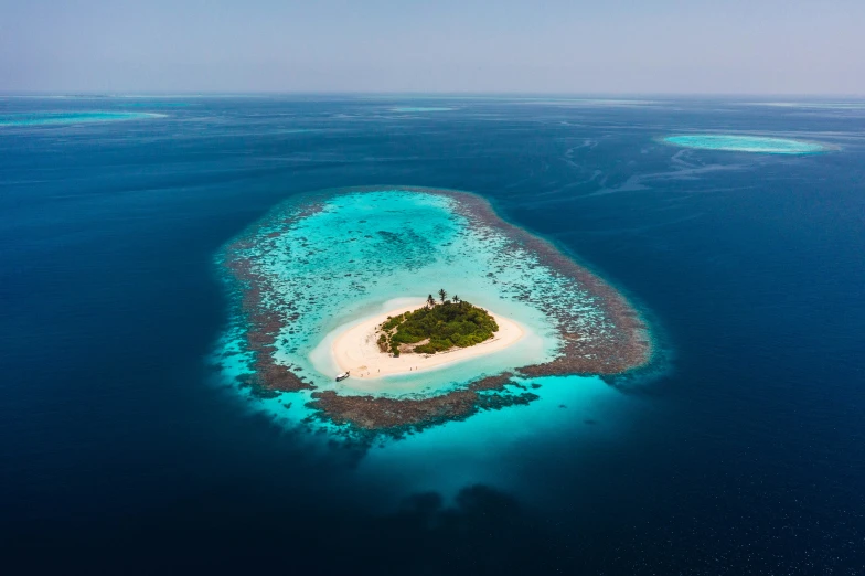 an island with some sand in the middle