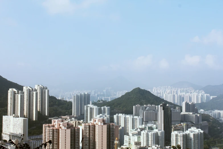 a tall white building with trees on top