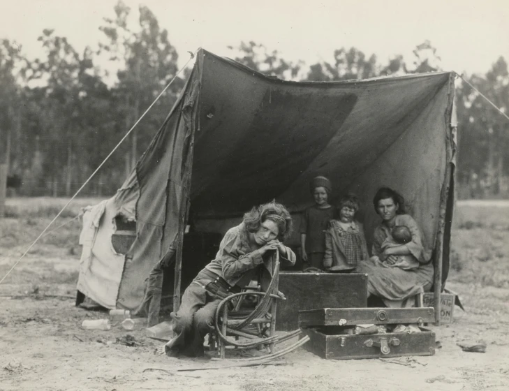 people are gathered together in an old tent