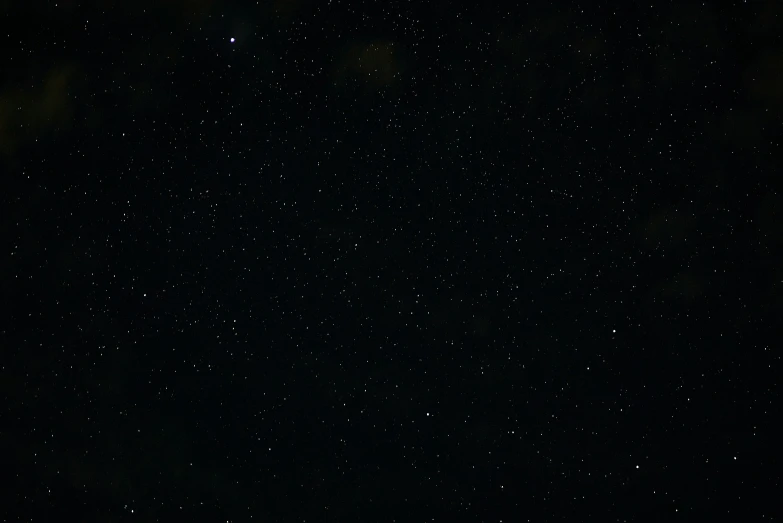 dark night sky with stars that are falling off the horizon