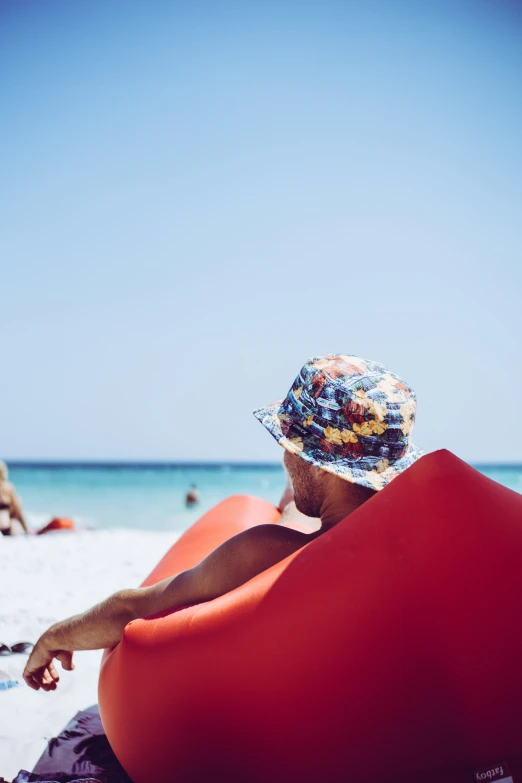 a woman sitting in a boat on the beach