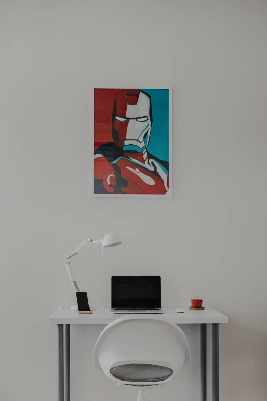 a modern style office with white chair and computer desk