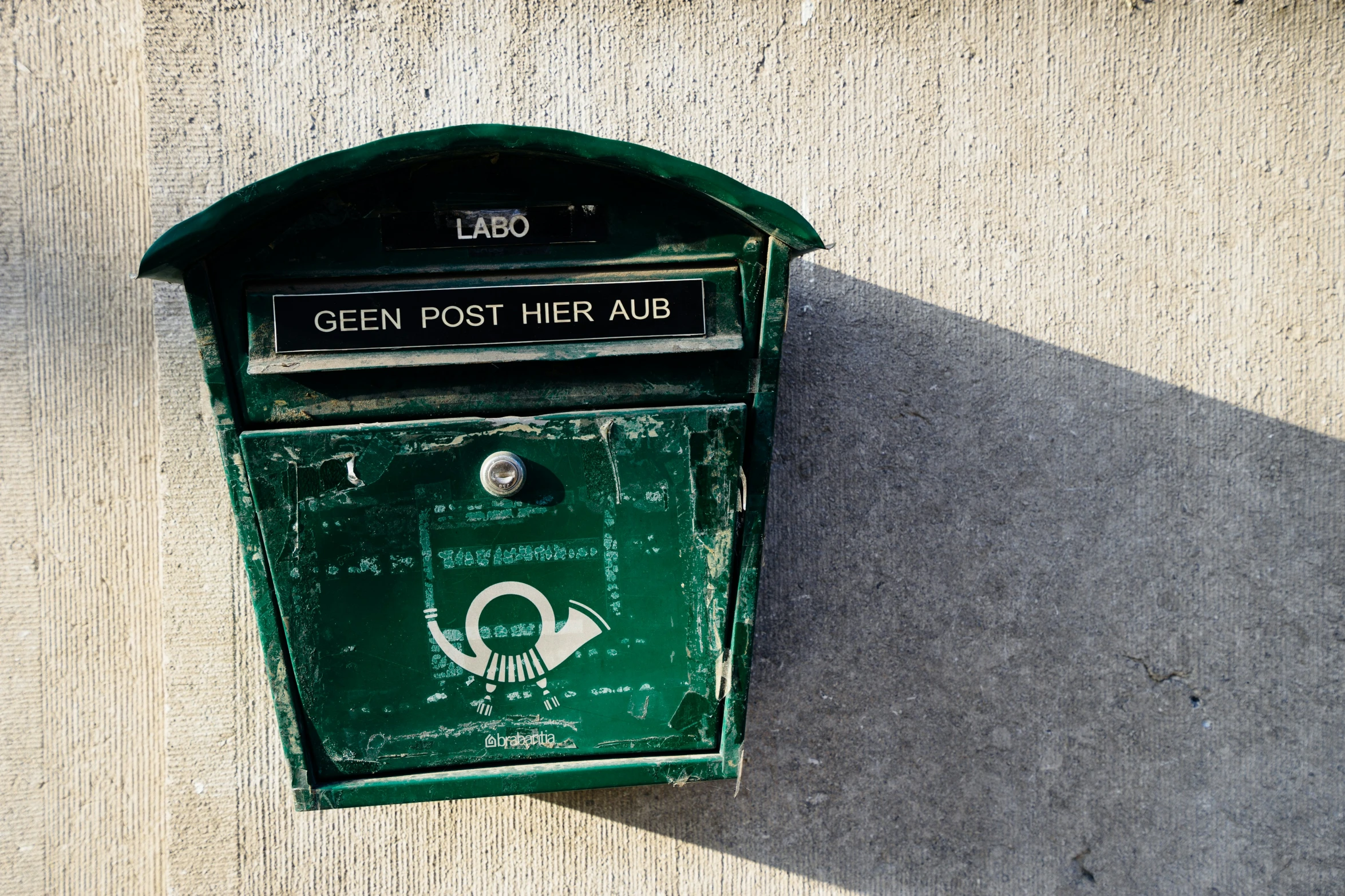 an old post office is placed close to the wall