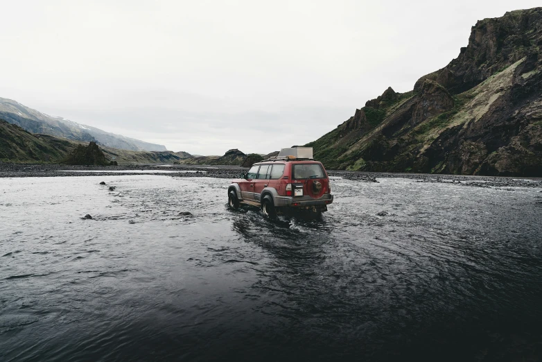 an suv that is in some dark water