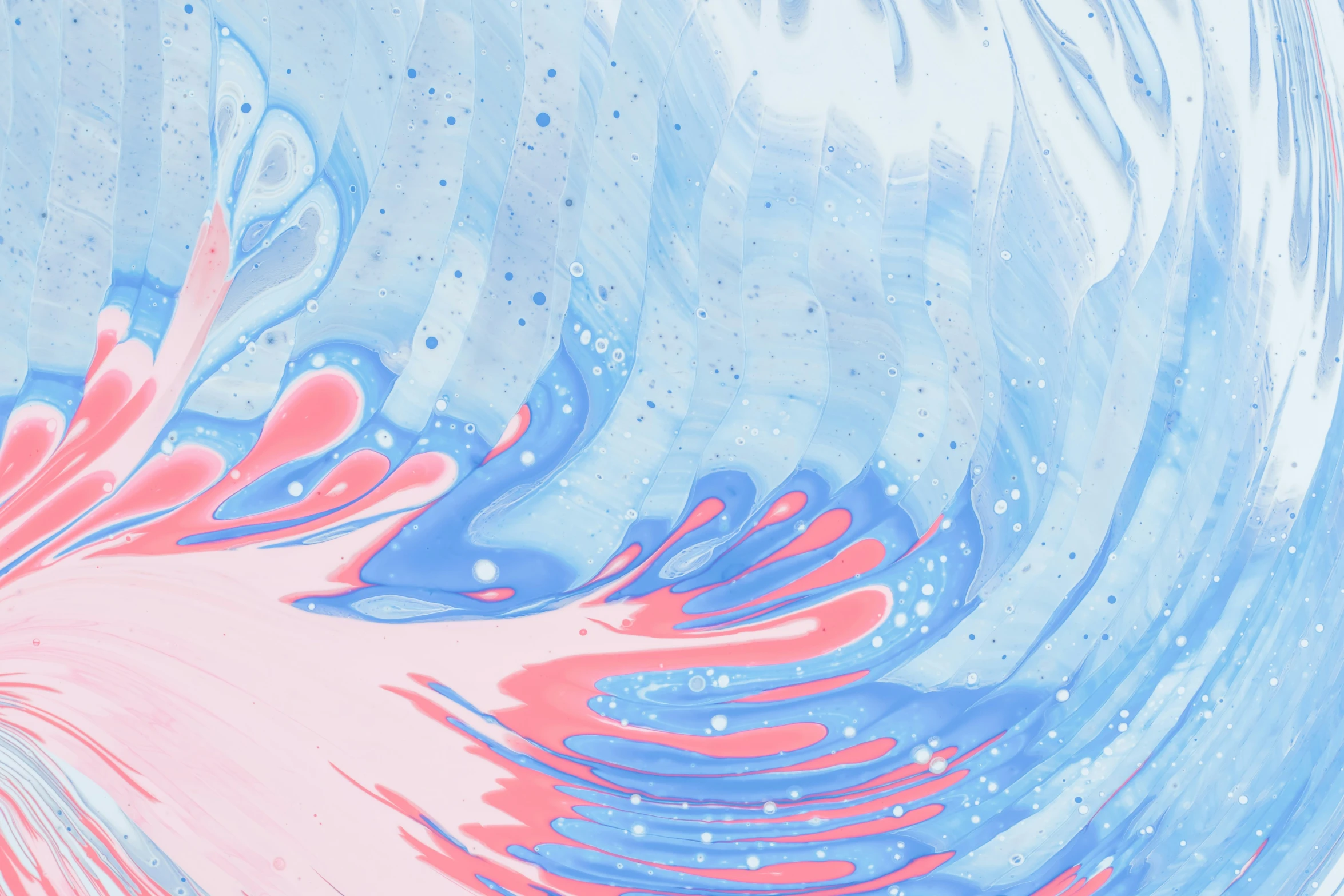 some paint on a blue and pink background