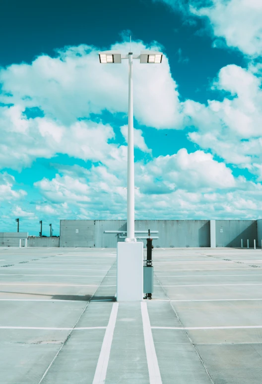 the person is standing under the street light