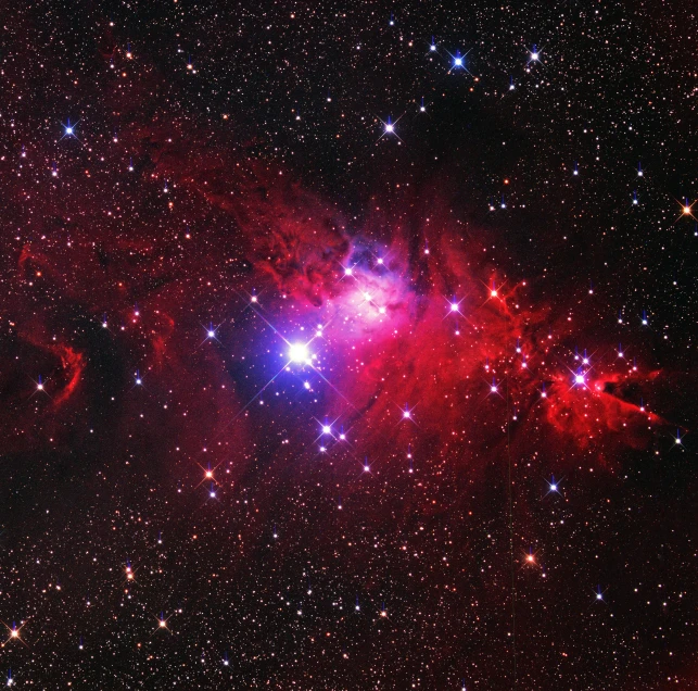bright red and black colored stars and dust on a clear, dark background