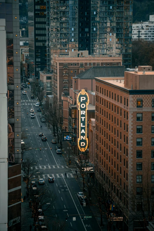 a very big sign with some light up lights hanging off the sides of it