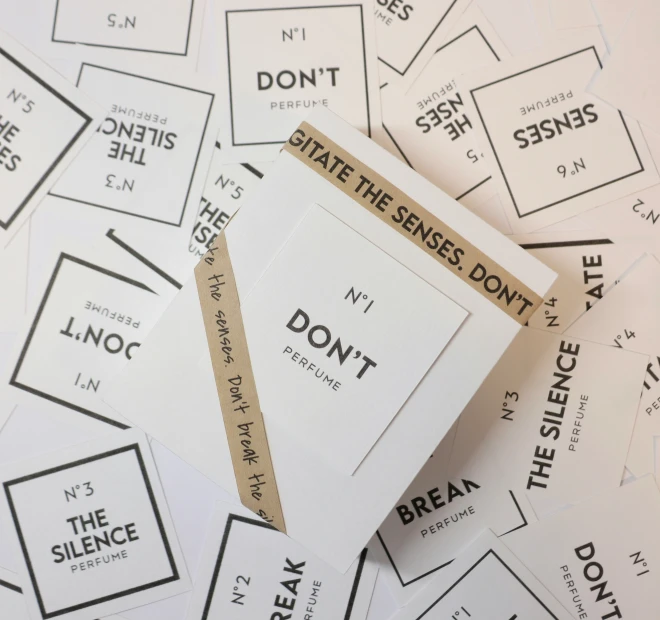 a pile of stickers with words and words attached