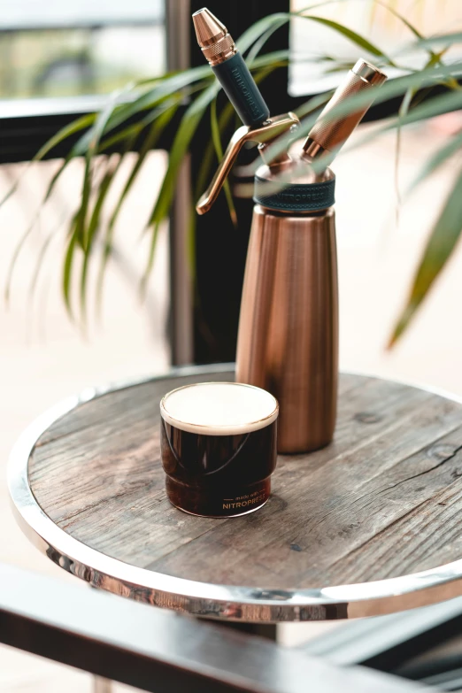 toothbrushes sitting on top of a brown coffee cup