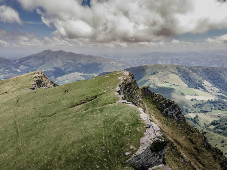 a mountain landscape view from the top of a large cliff