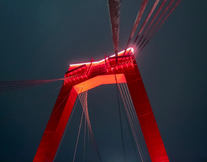 the red lights shine down on the bridge