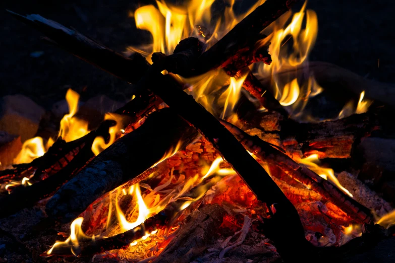 a bonfire with flames and bright, colorful burners