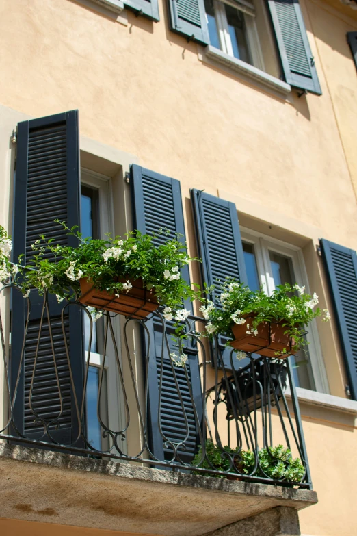 an apartment building with some planters on the balconies