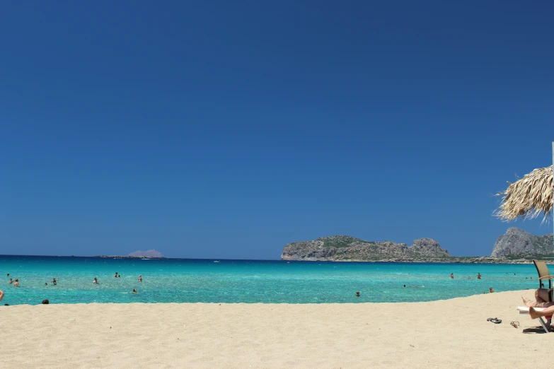 a man relaxing on the beach while reading