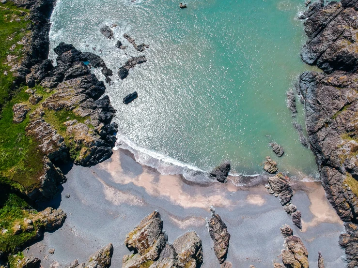 aerial view of a large body of water near some rocky coastlines