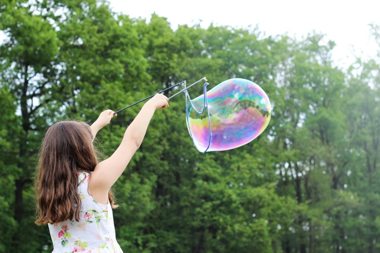 a  trying to fly a large bubble - filled kite