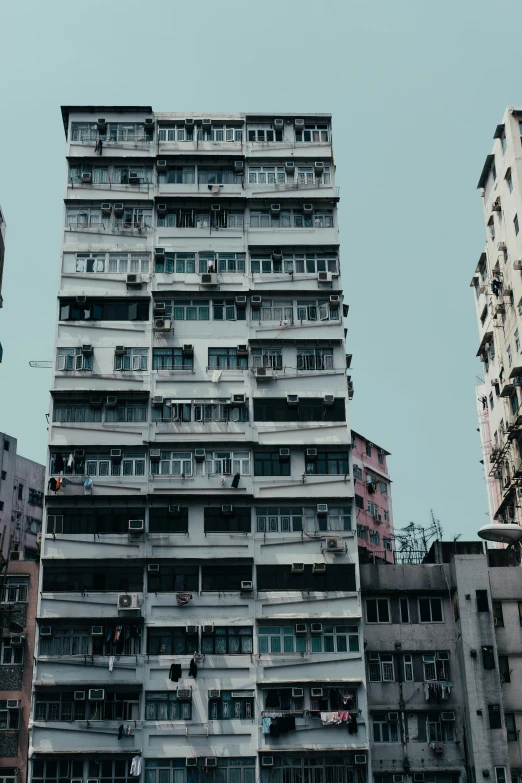 a tall building with balconies towering into the sky