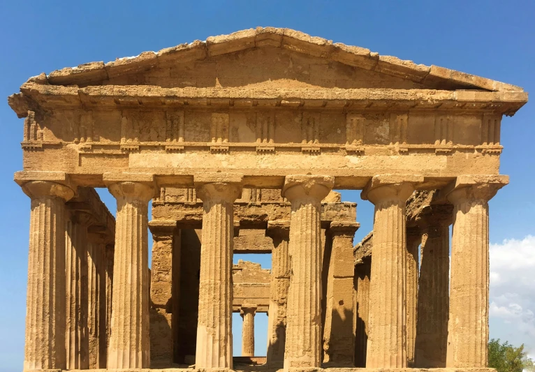 an old greek temple has pillars and a domed roof