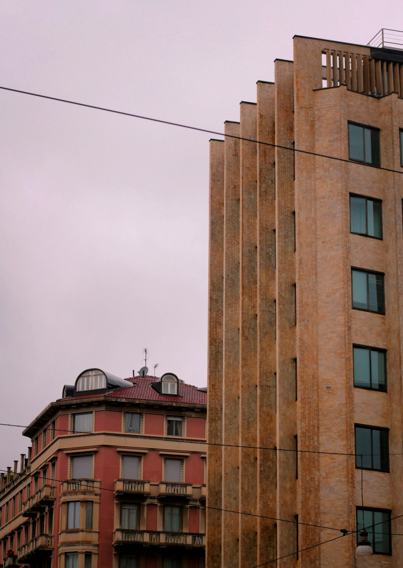 two very tall buildings near one another